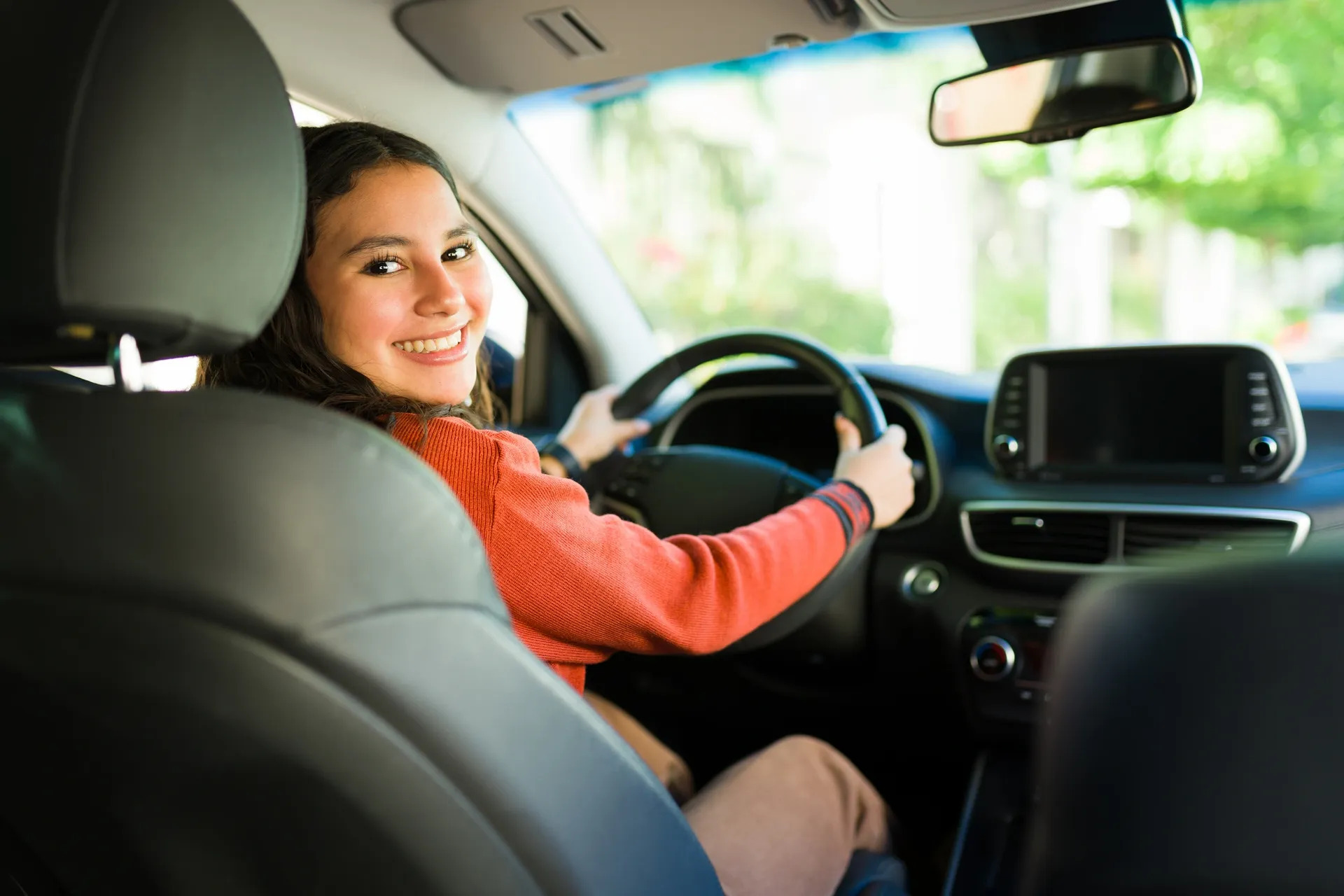 Professional instructor teaching driving techniques